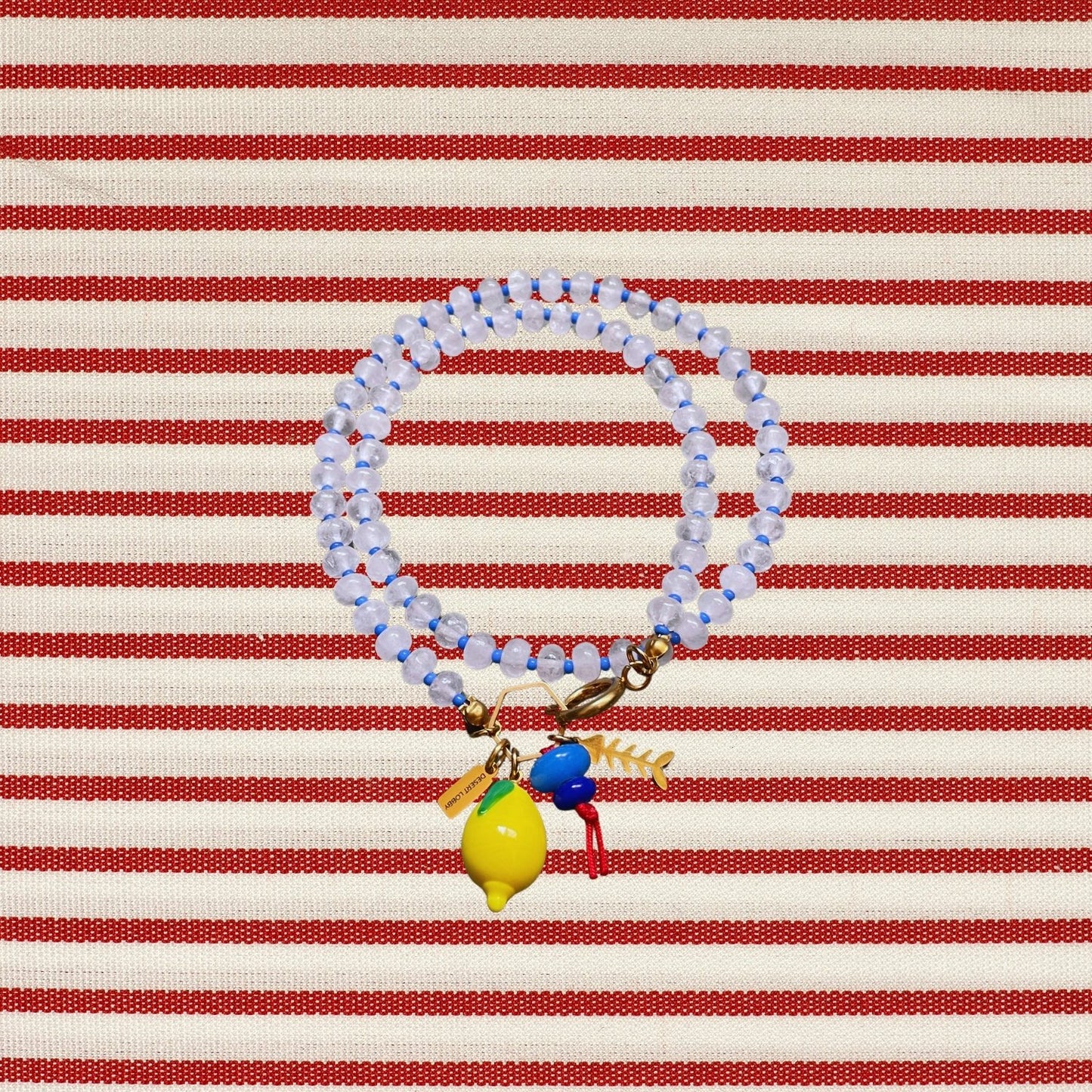 Fishbone | Quartz Necklace with Steel Fishbone and Murano Glass Lemon Charm
