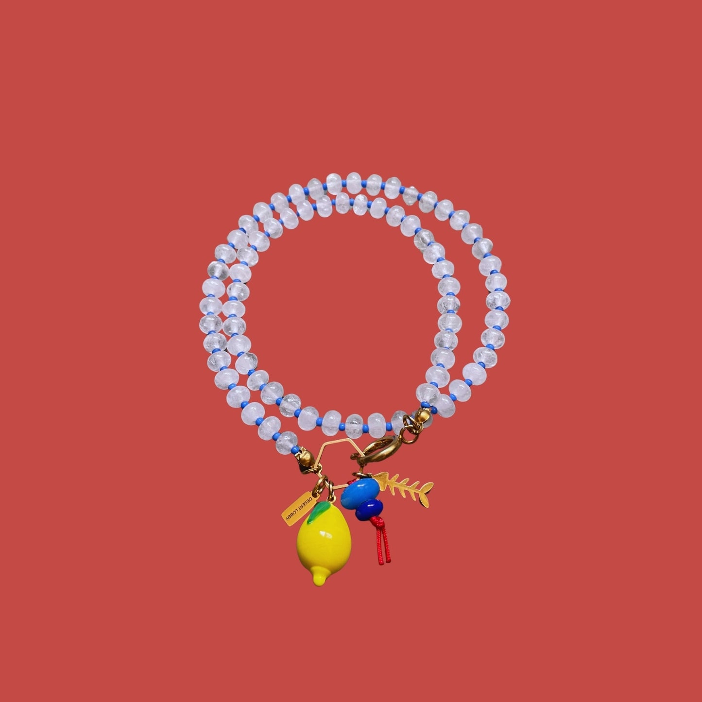 Fishbone | Quartz Necklace with Steel Fishbone and Murano Glass Lemon Charm