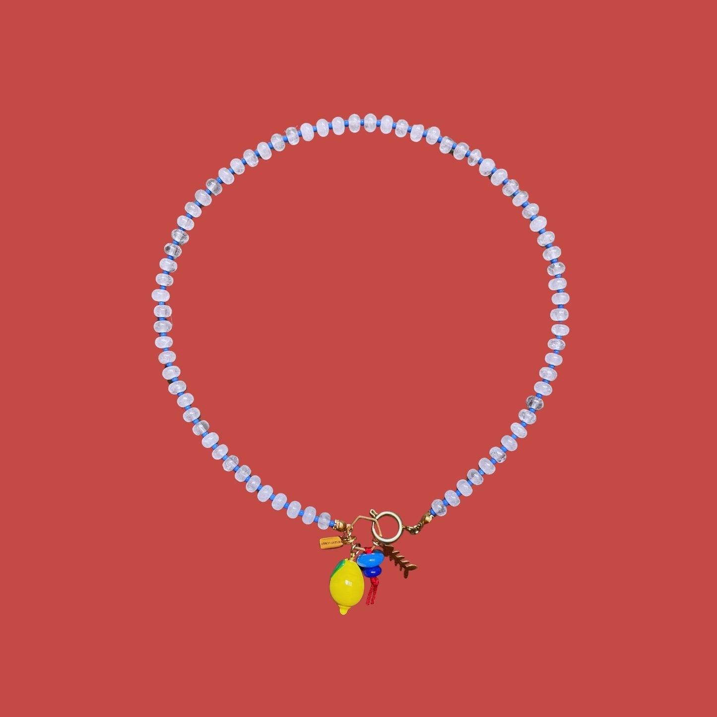 Fishbone | Quartz Necklace with Steel Fishbone and Murano Glass Lemon Charm