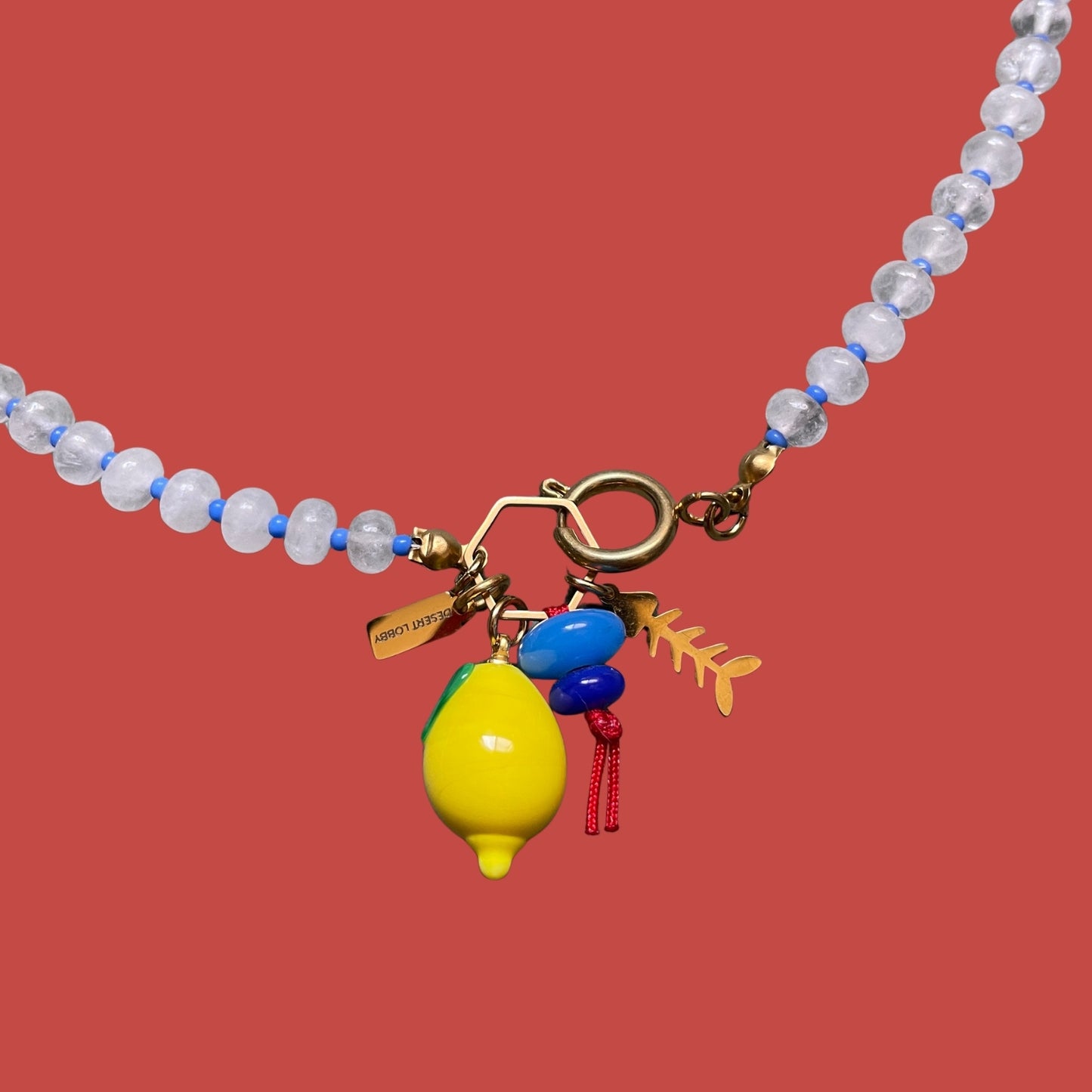 Fishbone | Quartz Necklace with Steel Fishbone and Murano Glass Lemon Charm